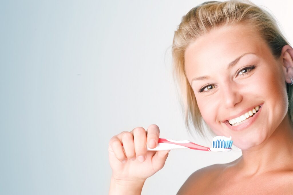 Smiling girl enjoying her dental care routine